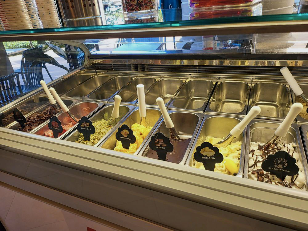 Trays of homemade gelato in a dozen colorful flavors at Amore Caffè